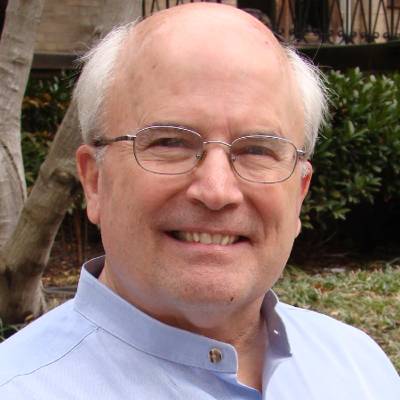 Timothy Donahue, Ph.D., in front of greenery