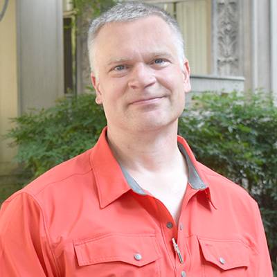 Thomas Eissenberg, Ph.D., in front of greenery