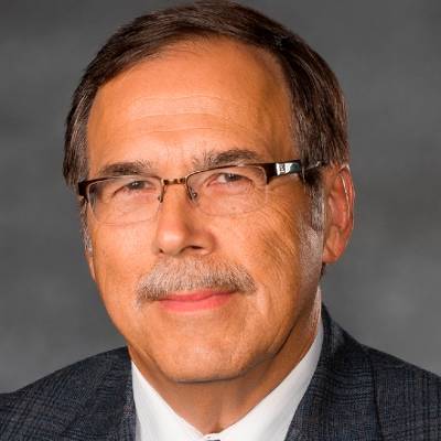 Albert Farrell, Ph.D., in front of a grey screen