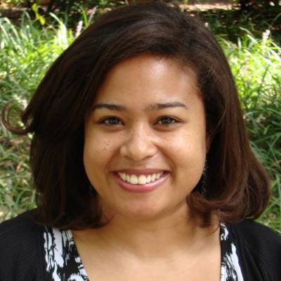 Heather Jones, Ph.D., in front of greenery