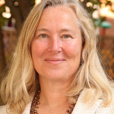 Mary Loos, Ph.D., in front of trees