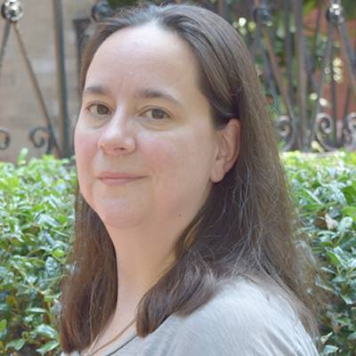 Maureen Mathews, Ph.D., in front of greenery