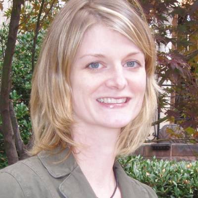 Suzanne Mazzeo, Ph.D., in front of greenery