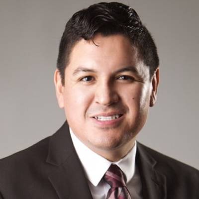 Oswaldo Moreno, Ph.D., in front of a grey screen