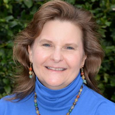 Victoria Shivy, Ph.D., in front of greenery