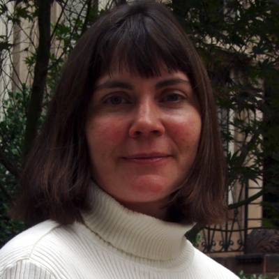 Terri Sullivan, Ph.D., in front of greenery